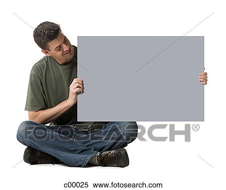 Stock Photography - Man holding a blank sign. Fotosearch