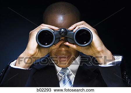 Man looking through binoculars View Large Photo Image Stock Image - Man looking through binoculars. Fotosearch