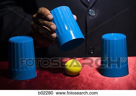 Man playing the shell game / closeup. View Large Photo Image Stock Image - Man playing the shell game / closeup.. Fotosearch