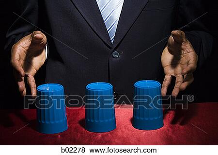 Man playing the shell game / closeup. View Large Photo Image Stock Photo - Man playing the shell game / closeup.. Fotosearch