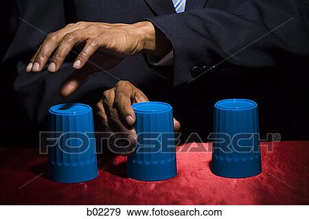 Man playing the shell game / closeup. View Large Photo Image Stock Photo - Man playing the shell game / closeup.. Fotosearch