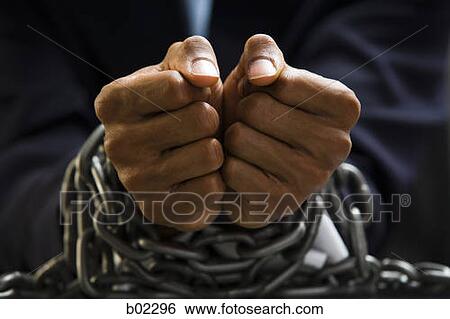 Man with chains around wrists View Large Photo Image Stock Photograph - Man with chains around wrists. Fotosearch