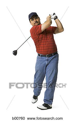 Mature man swinging a golf club View Large Photo Image Stock Image - Mature man swinging a golf club. Fotosearch