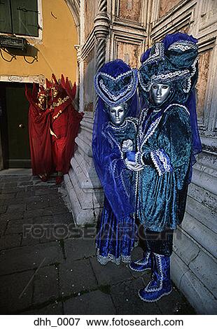 Stock Photo - Men and women dressed in masquerade costumes. Fotosearch
