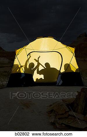 Men and women sitting in a tent View Large Photo Image Stock Image - Men and women sitting in a tent. Fotosearch