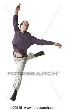 Mid adult man dancing View Large Photo Image Stock Photography - Mid adult man dancing. Fotosearch