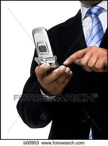 Mid section view of a businessman using a mobile phone View Large Photo Image Stock Image - Mid section view of a businessman using a mobile phone. Fotosearch