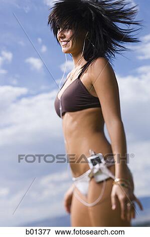 MP3 Player in a young woman's bikini bottom View Large Photo Image Stock Photo - MP3 Player in a young woman's bikini bottom. Fotosearch