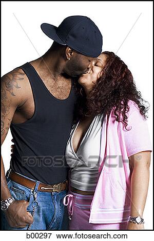 Multi-ethnic couple kissing each other View Large Photo Image Stock Photo - Multi-ethnic couple kissing each other. Fotosearch