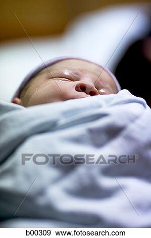 Newborn baby girl swathed in clothes View Large Photo Image Stock Photo - Newborn baby girl swathed in clothes. Fotosearch