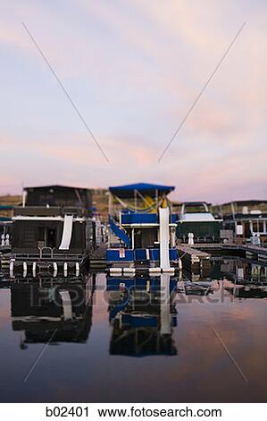 Panoramic view of boathouses in a row View Large Photo Image Stock Image - Panoramic view of boathouses in a row. Fotosearch