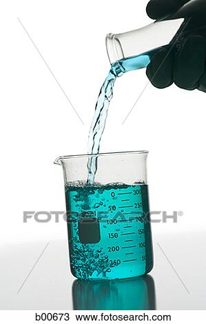 Person pouring chemical into a beaker View Large Photo Image Stock Image - Person pouring chemical into a beaker. Fotosearch