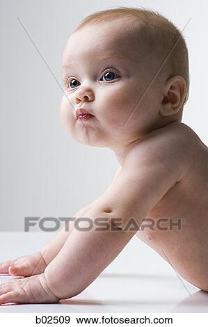 Stock Photo - Portrait of a baby, crawling. Fotosearch