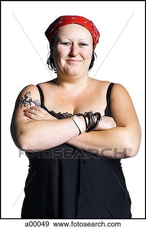 Portrait of a biker chick standing with her arms folded View Large Photo Image Stock Photo - Portrait of a biker chick standing with her arms folded. Fotosearch