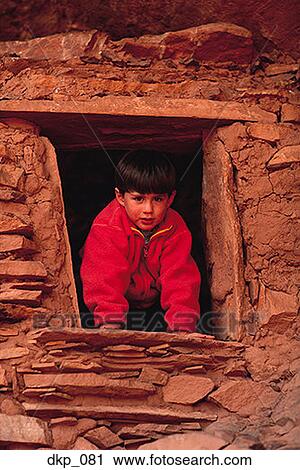 Portrait of a boy leaning out of a window View Large Photo Image Stock Image - Portrait of a boy leaning out of a window. Fotosearch