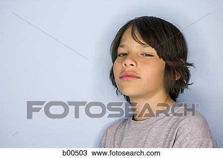 Portrait of a boy looking serious View Large Photo Image Stock Image - Portrait of a boy looking serious. Fotosearch