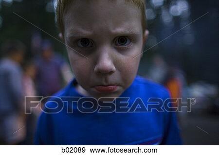 Portrait of a boy making a face View Large Photo Image Stock Photo - Portrait of a boy making a face. Fotosearch