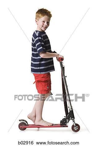 Stock Photograph - Portrait of a boy on a scooter. Fotosearch