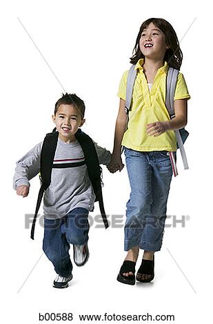 Portrait of a brother walking with his sister View Large Photo Image Stock Photo - Portrait of a brother walking with his sister. Fotosearch
