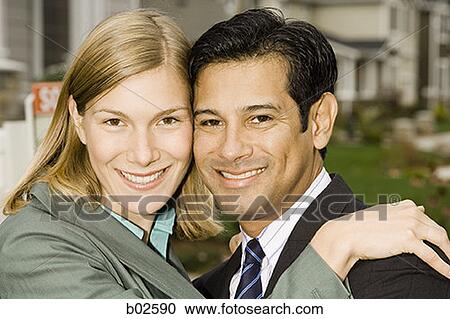 Portrait of a businessman and a businesswoman smiling View Large Photo Image Stock Image - Portrait of a businessman and a businesswoman smiling. Fotosearch