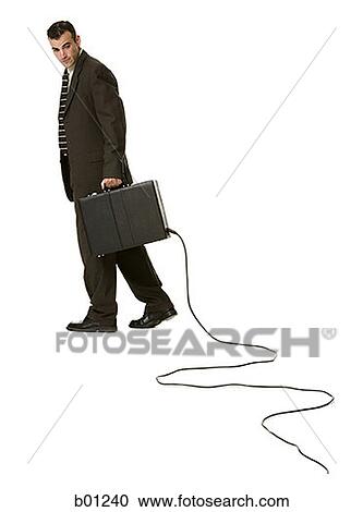 Portrait of a businessman holding a briefcase with an electrical cord View Large Photo Image Stock Image - Portrait of a businessman holding a briefcase with an electrical cord. Fotosearch