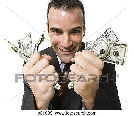 Portrait of a businessman holding dollar bills View Large Photo Image Stock Photo - Portrait of a businessman holding dollar bills. Fotosearch
