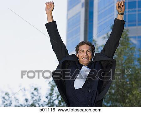 Stock Photograph - Portrait of a businessman jumping up. Fotosearch