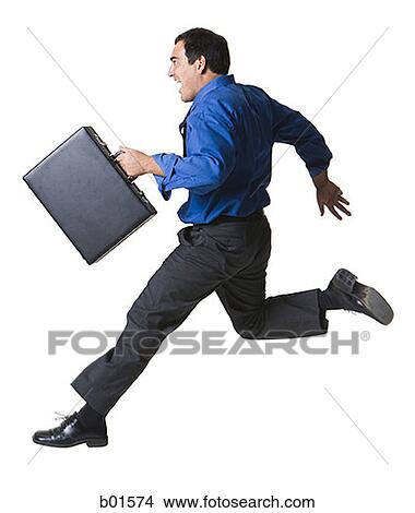 Portrait of a businessman jumping with a briefcase View Large Photo Image Picture - Portrait of a businessman jumping with a briefcase. Fotosearch