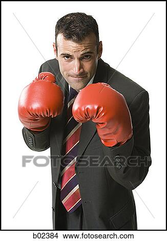 Portrait of a businessman wearing boxing gloves View Large Photo Image Picture - Portrait of a businessman wearing boxing gloves. Fotosearch