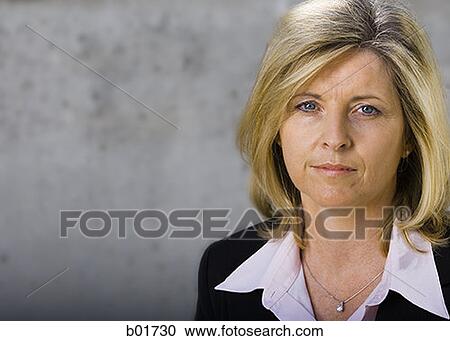 Portrait of a businesswoman looking serious View Large Photo Image Stock Image - Portrait of a businesswoman looking serious. Fotosearch