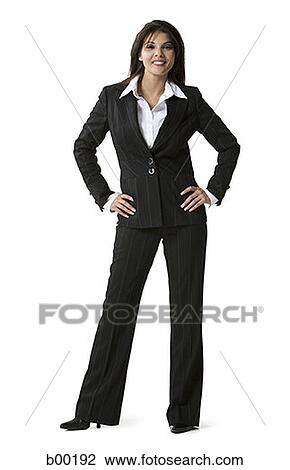 Portrait of a businesswoman standing with arms akimbo View Large Photo Image Stock Image - Portrait of a businesswoman standing with arms akimbo. Fotosearch