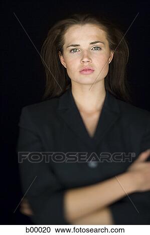 Stock Image - Portrait of a businesswoman with her arms crossed. Fotosearch