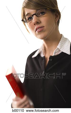 Portrait of a college student holding a book View Large Photo Image Stock Image - Portrait of a college student holding a book. Fotosearch