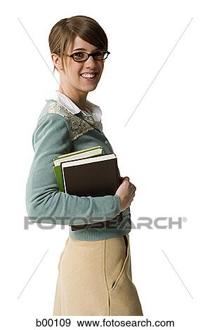 Stock Photo - Portrait of a college student holding books. Fotosearch