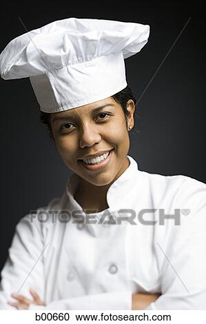 Portrait of a female chef smiling View Large Photo Image Stock Image - Portrait of a female chef smiling. Fotosearch