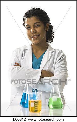 Portrait of a female chemist standing with her arms crossed View Large Photo Image Stock Image - Portrait of a female chemist standing with her arms crossed. Fotosearch