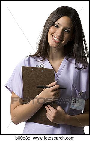 Stock Photography - Portrait of a female nurse holding a clipboard. Fotosearch