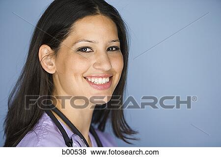 Portrait of a female nurse smiling View Large Photo Image Stock Photo - Portrait of a female nurse smiling. Fotosearch