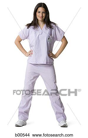 Portrait of a female nurse standing with arms akimbo View Large Photo Image Picture - Portrait of a female nurse standing with arms akimbo. Fotosearch