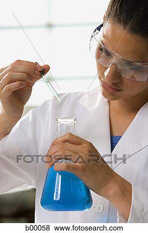 Portrait of a female scientist at work in the lab View Large Photo Image Stock Photo - Portrait of a female scientist at work in the lab. Fotosearch