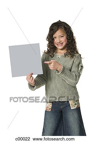 Portrait of a girl holding a blank sign View Large Photo Image Stock Image - Portrait of a girl holding a blank sign. Fotosearch