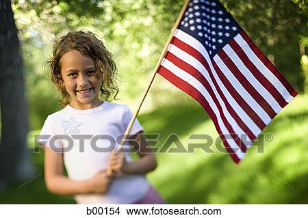 Portrait of a girl holding an American Flag View Large Photo Image Picture - Portrait of a girl holding an American Flag. Fotosearch