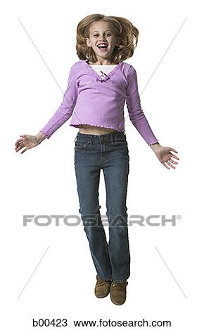 Stock Image - Portrait of a girl jumping. Fotosearch