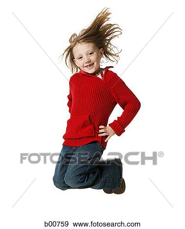 Stock Photo - Portrait of a girl jumping with arms akimbo. Fotosearch