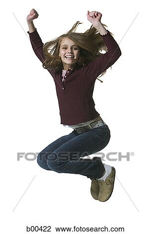 Portrait of a girl jumping with her arms raised View Large Photo Image Stock Image - Portrait of a girl jumping with her arms raised. Fotosearch
