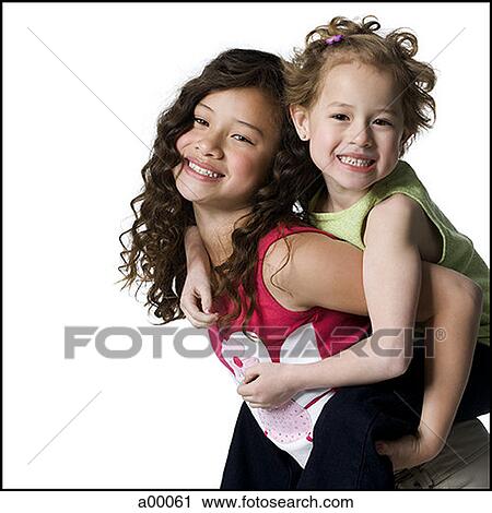 Portrait of a girl riding piggyback on her sister View Large Photo Image Stock Image - Portrait of a girl riding piggyback on her sister. Fotosearch