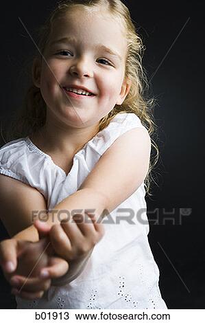 Stock Image - Portrait of a girl smiling. Fotosearch