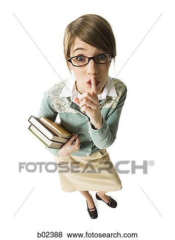 Portrait of a librarian with a finger on her lips View Large Photo Image Stock Photo - Portrait of a librarian with a finger on her lips. Fotosearch