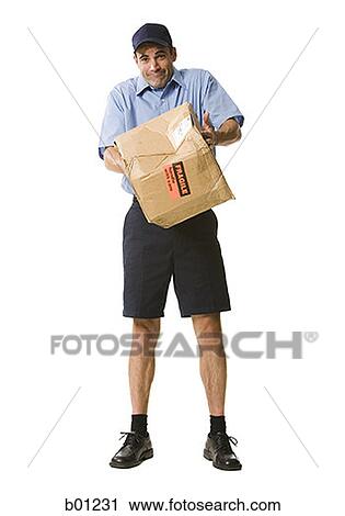 Portrait of a mailman holding a damaged package View Large Photo Image Stock Image - Portrait of a mailman holding a damaged package. Fotosearch