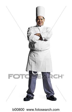 Portrait of a male chef standing with his arms folded View Large Photo Image Stock Image - Portrait of a male chef standing with his arms folded. Fotosearch